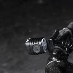 SILVA Exceed 4XT headlamp main with battery beside-product fixed on the bike frame