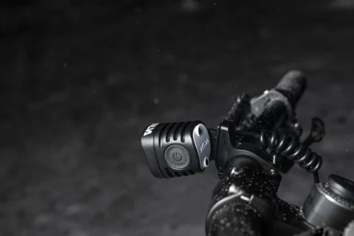 SILVA Exceed 4XT headlamp main with battery beside-product fixed on the bike frame