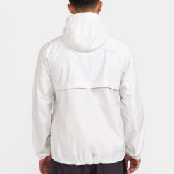 Runner wearing CRAFT PRO TRAIL 2L Light Weight Jacket Men – lightweight, breathable trail running jacket with taped seams for all-weather protection (back)