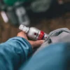 lifesystems-expedition-max-mosquito-repellent-lifestyle Traveller putting in his pocket Lifesystems Expedition MAX mosquito repellent before tropical travel