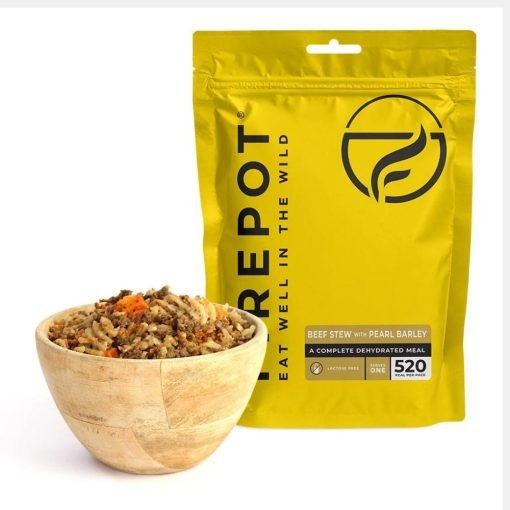 lightweight dehydrated Firepot Beef Stew with Pearl Barley pouch beside a serving of beef stew.